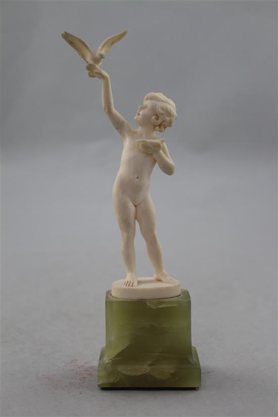 Ferdinand Preiss (German, 1882-1943). An Art Deco carved ivory figure of a young girl feeding a bird, 7.5in.